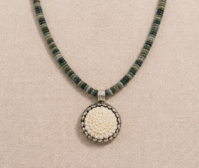 High Desert Agate Necklace with natural agate beads and carved bone flower pendant on linen background