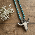 Desert Prairie Longhorn Necklace with jasper beads and carved bone longhorn pendant on wood background