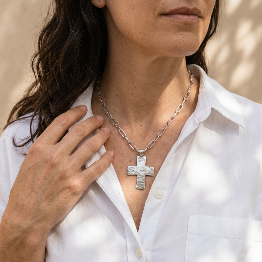 High Plains Cross Necklace worn layered with artisan jewelry silver