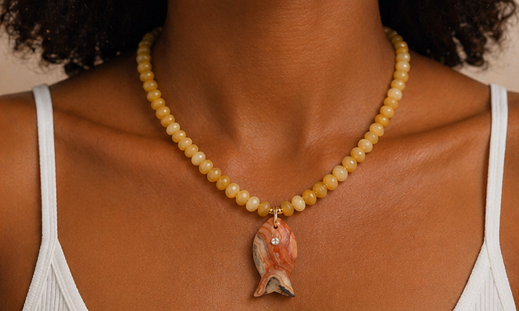 Salt and Stone gemstone fish necklace worn on model showcasing boho coastal style